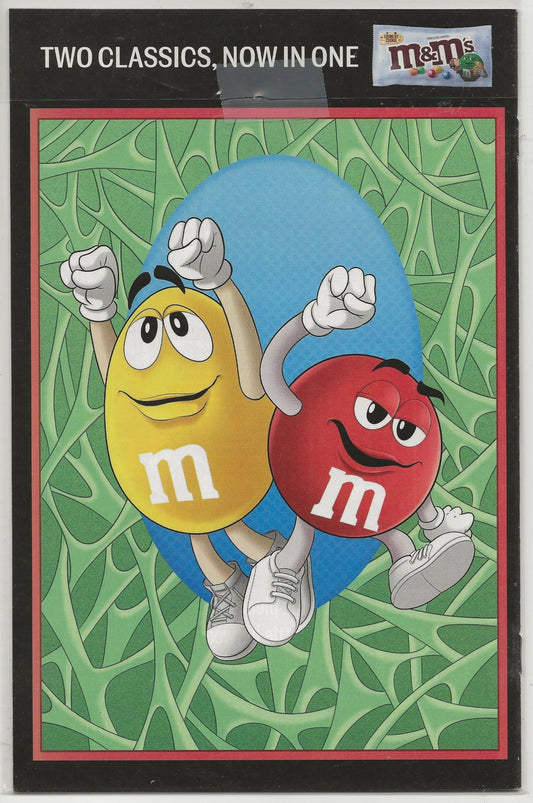 A single collectible trading card featuring the classic red and yellow M&M's characters dancing together on a green leafy background. The card has a black border with the text 'TWO CLASSICS.