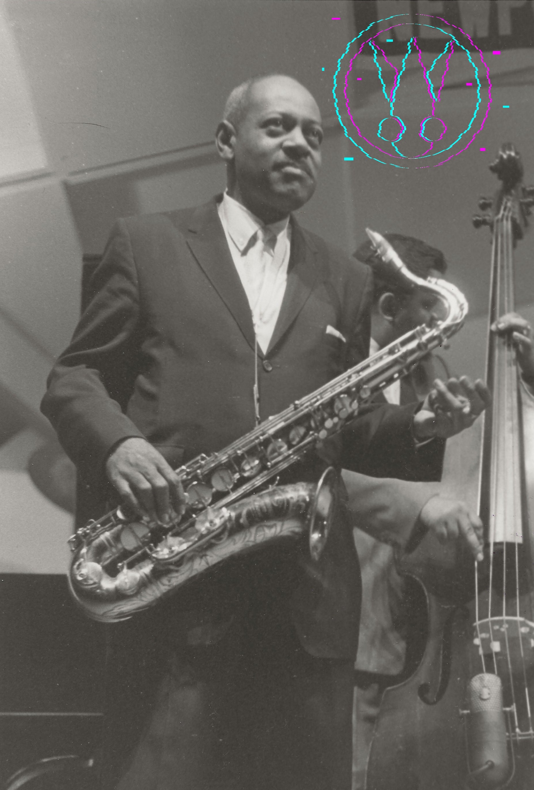 A black and white photograph of a jazz musician playing a saxophone, with another musician and a double bass visible in the background. A stylized graphic overlay is present in the upper right corner.