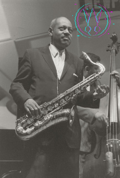 A black and white photograph of a jazz musician playing a saxophone, with another musician and a double bass visible in the background. A stylized graphic overlay is present in the upper right corner.